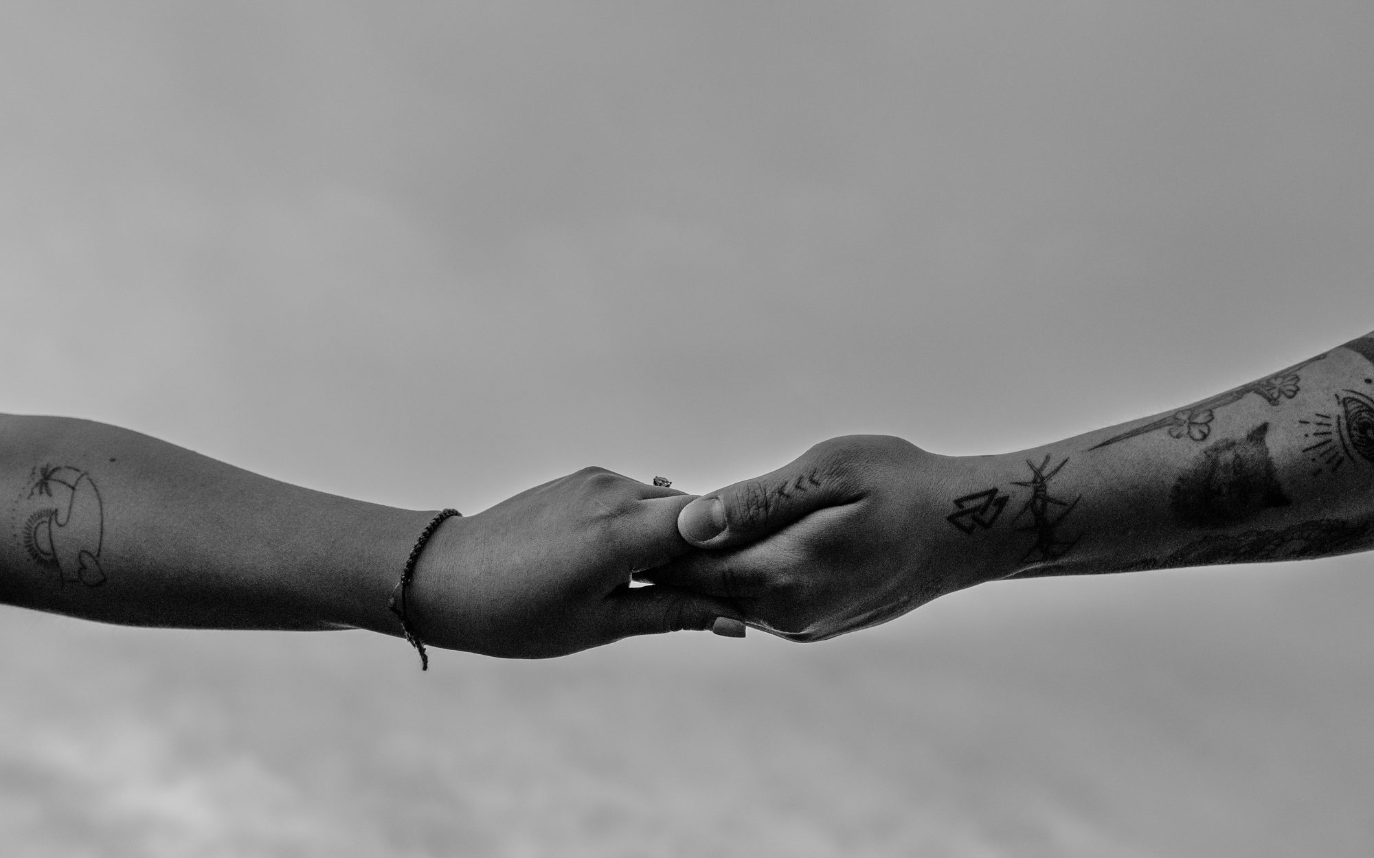 The couple holding hands, black and white photograph